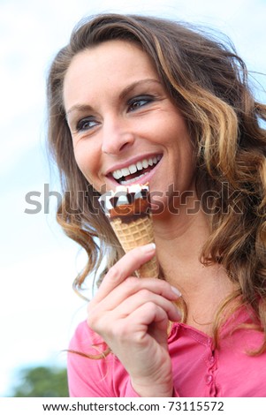 Portrait of woman eating ice cream cone
