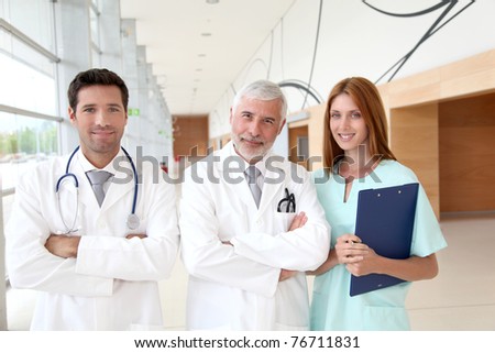 Portrait of medical team standing in hospital hall