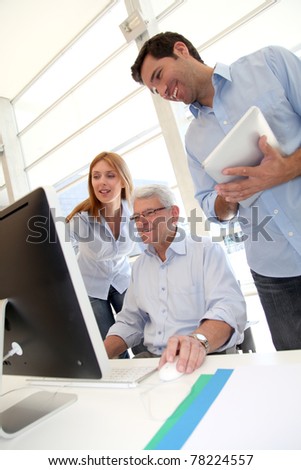 Senior people attending business training