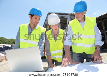 Industrial people working on building site