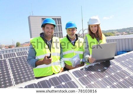 Group of engineers meeting on building roof