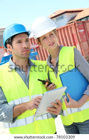 Work team meeting on building site