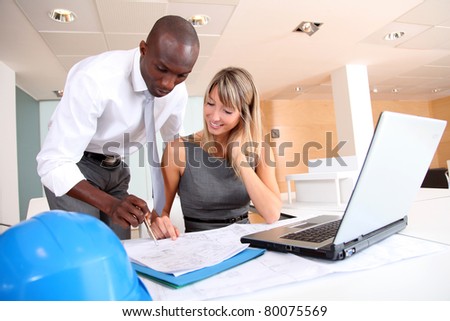 Architects working on laptop computer