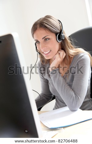 Portrait of beautiful office worker sitting at her desk