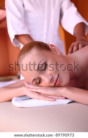 Woman enjoying essential oil massage