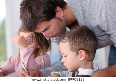 Man helping kids with homework