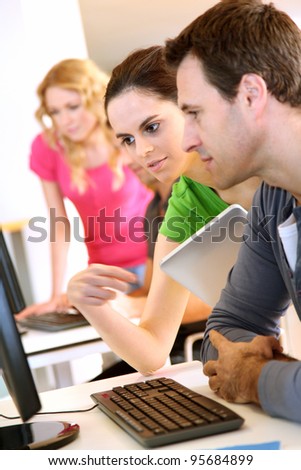People working on desktop computer