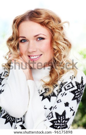 Portrait of beautiful blond woman with wool sweater
