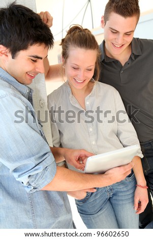 Group of friends at school using tablet