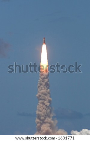 Space shuttle launch â€“ STS 121. Photoâ€™s technical quality is low due to large distance from object - better to use in smaller resolution.