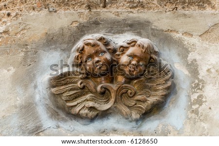 angel faces on the wall (in Rome)