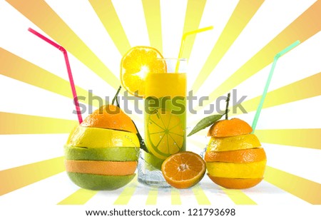 Mix of sliced citrus fruits and a glass of fresh juice
