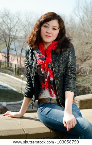 a beautiful girl with brown hair and red scarf