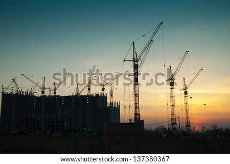 Crane at a construction site a new home Crane at a construction site a new home
