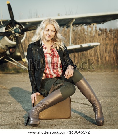 girl  sits at the plane