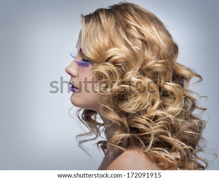 Beautiful blond girl with fluffy hair