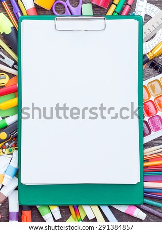 Tablet with a clean sheet and items for school or children\'s creativity