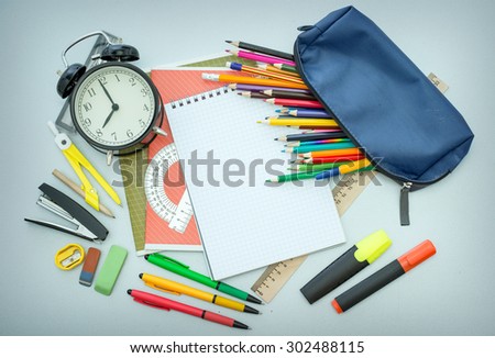 pencil case with pencils on the table