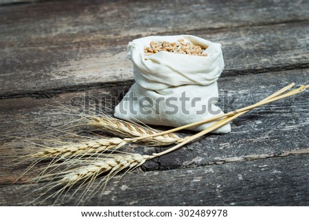 bag with wheat grains and ears