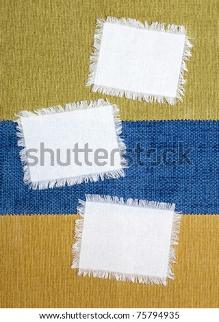 three piece of white fabric on the background of colored fabric