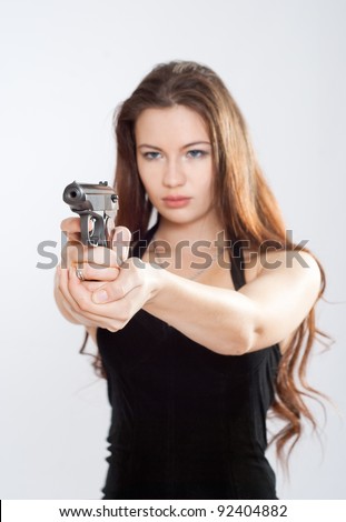 Girl aiming a gun, arms outstretched