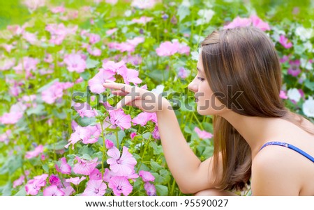 Girl with flowers in the garden