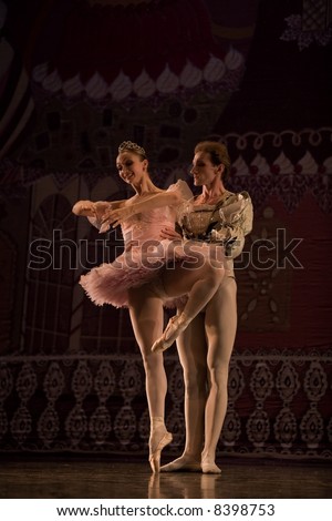 classic ballet male dancer standing by  female dancer on painted background