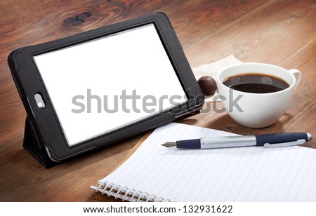 Coffee, tablet PC, pen and notepad