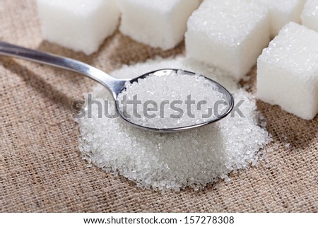Sugar Is In The Spoon On The Table
