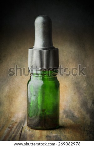 Eye Dropper Bottle on a textured background