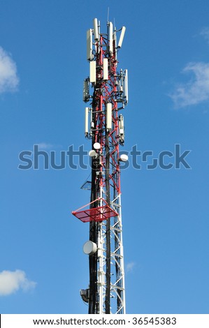 Big communication tower with GSM and microwave antenna.