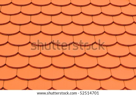 Detail of a house red roof tiles.