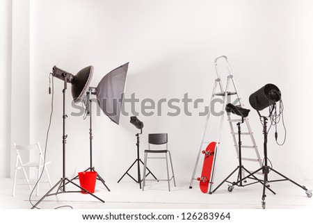 Empty photographic studio with modern lighting equipment