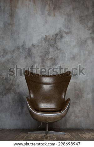 Modern fashion and stylish chair against stucco wall