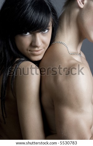 Sexy passionate brunette posing against cool athletic body. Find more similar in my portfolio