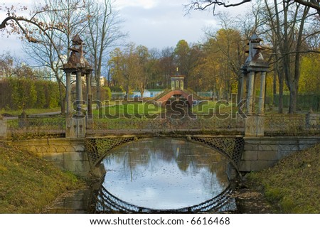 Old nameless bridge in the park. Also you can see China bridge in the background . Autumn, Tsarskoe selo, Russia