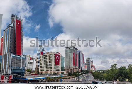 ISTANBUL, TURKEY - AUGUST 30 2014: Flags on business center buildings on national holiday