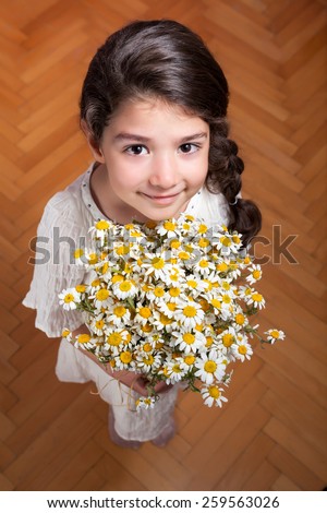 Cute girl giving flowers