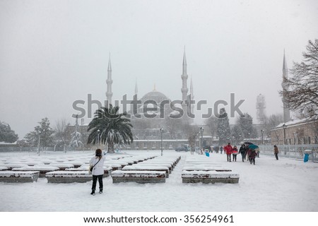 Istanbul, Turkey - FEBRUARY 19, 2015 : Tourists at the Sultan Ahmet Square in winter