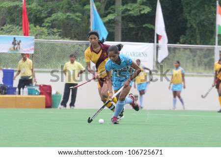 PATHUMTHANI,THAILAND - JUNE 27 : Unidentified player in Women\'s Junior PTT Asia Cup 2012 Between India (B) vs Sri Lanka (Y) on June 27, 2012 at National Hockey Trainging Center in Pathumthani,Thailand