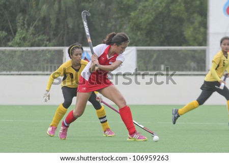PATHUMTHANI,THAILAND - JUNE 27 : Unidentified player in Women\'s Junior PTT Asia Cup 2012 Between Malaysia (Y) VS Singapore (R) on June 27, 2012 in Pathumthani,Thailand