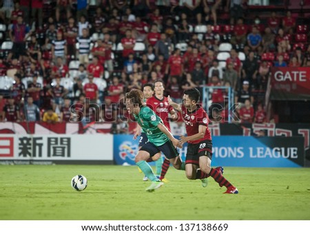BANGKOK, THAILAND- MAY 1 : Yajima Shinya (L) in action during AFC Champions League 2013 Between Muangthong Utd (R) Vs Urawa red Diamonds(G) on May 1, 2013 at SCG Stadium, Bangkok, Thailand