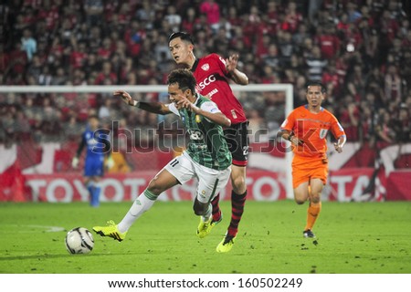 PATHUMTHANI,THAILAND OCT 20 : Hironori of MTUTD in action during Thai premier League 2013 between SCG MUANGTHONG UNITED and Bangkok Glass FC at SCG Stadium on October 20, 2013 in Thailand