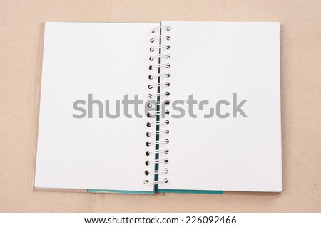 open diary or photo album book on brown background