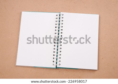 open diary or photo album book on brown backgroun