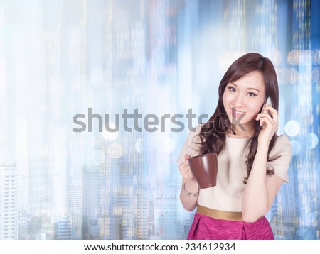 Businesswoman or stock broker ,use phone has stock exchange graph background
