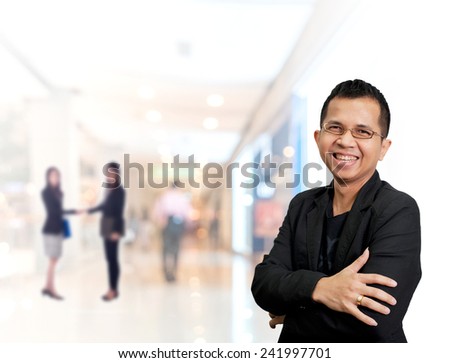 Portrait of young asia businessman has shopping mall background