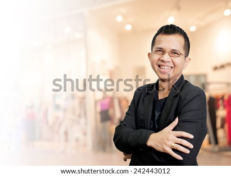 Portrait of young asia businessman has shopping mall background