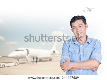 Portrait of young asia business man 30 - 40 year old has airport background.Positive emotion