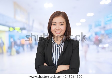 portrait of asian businesswomen 20-30 year old has airport background ..Mixed Asian / Caucasian businesswoman.